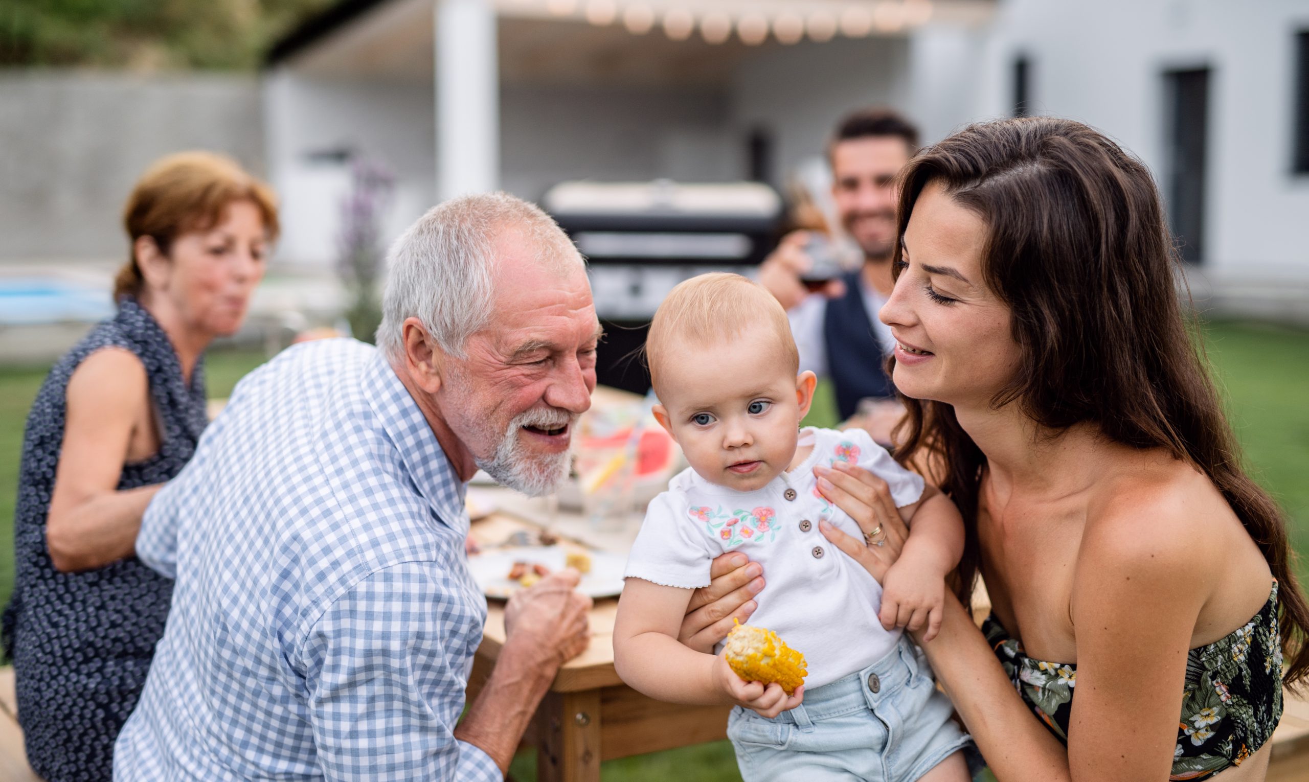 Extended family sitting together outdoors representing Virginia estate planning