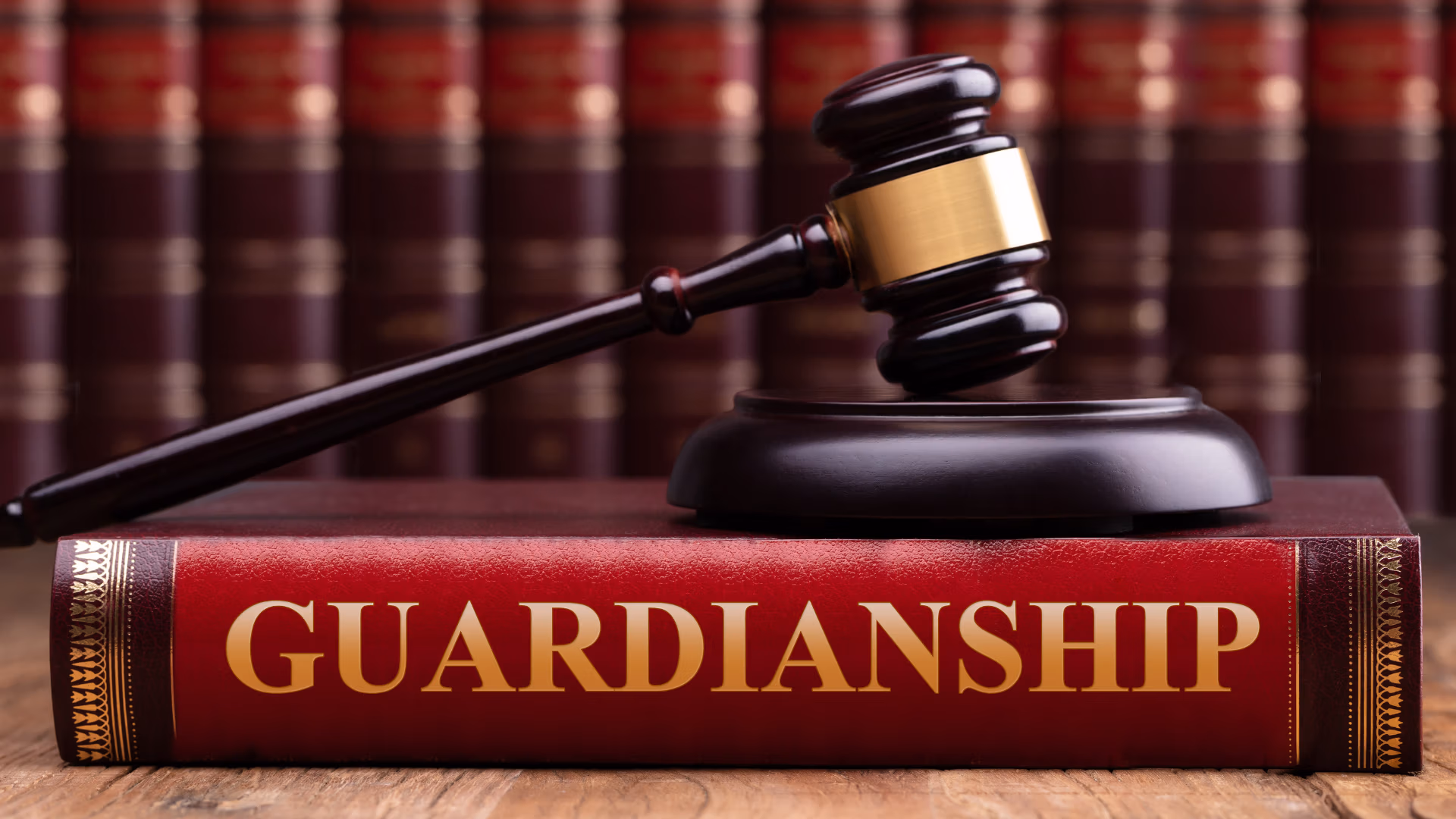 Judge’s gavel resting on a law book titled “Guardianship,” symbolizing legal authority and elder or special needs protection.