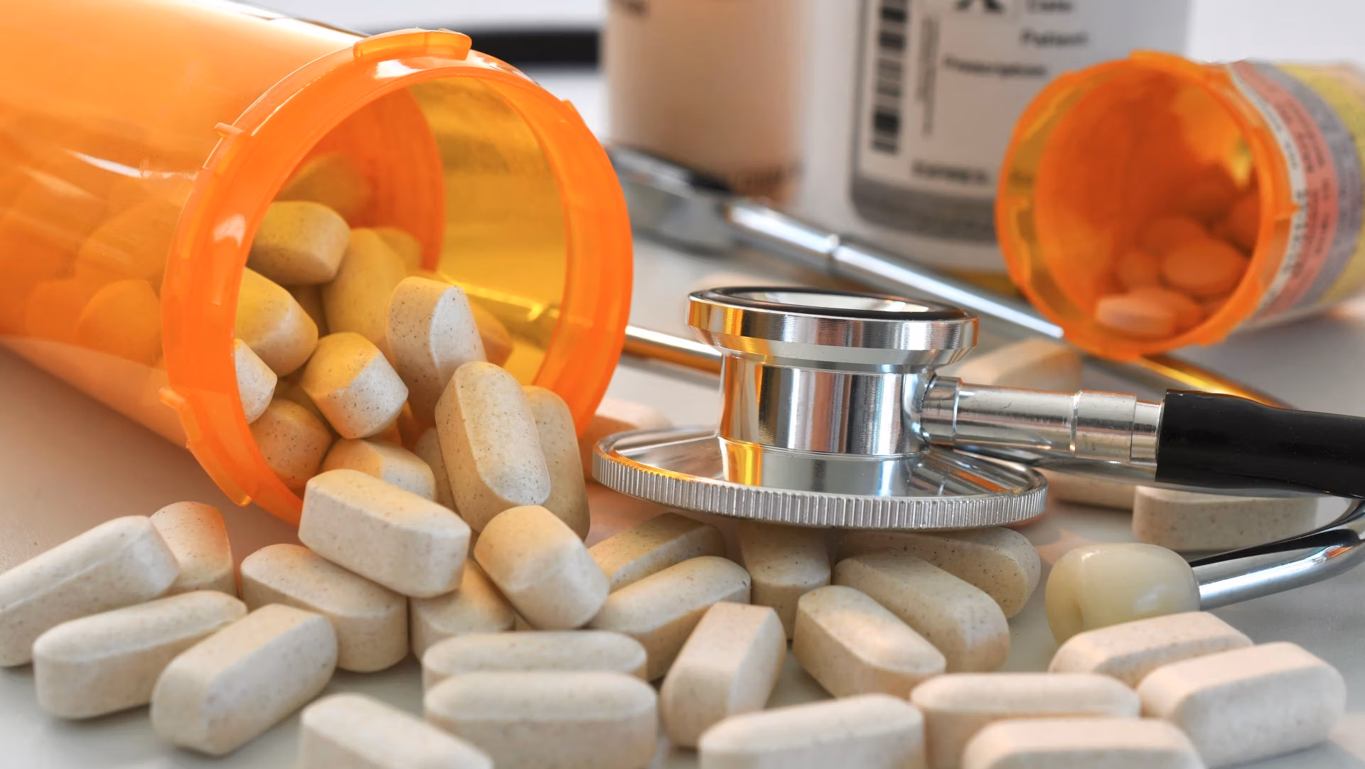 Prescription pills and stethoscope symbolizing medical decisions and healthcare planning