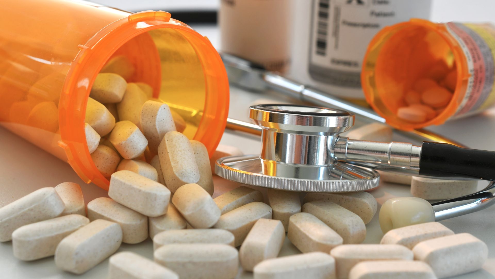 Prescription pills and stethoscope symbolizing medical decisions and healthcare planning