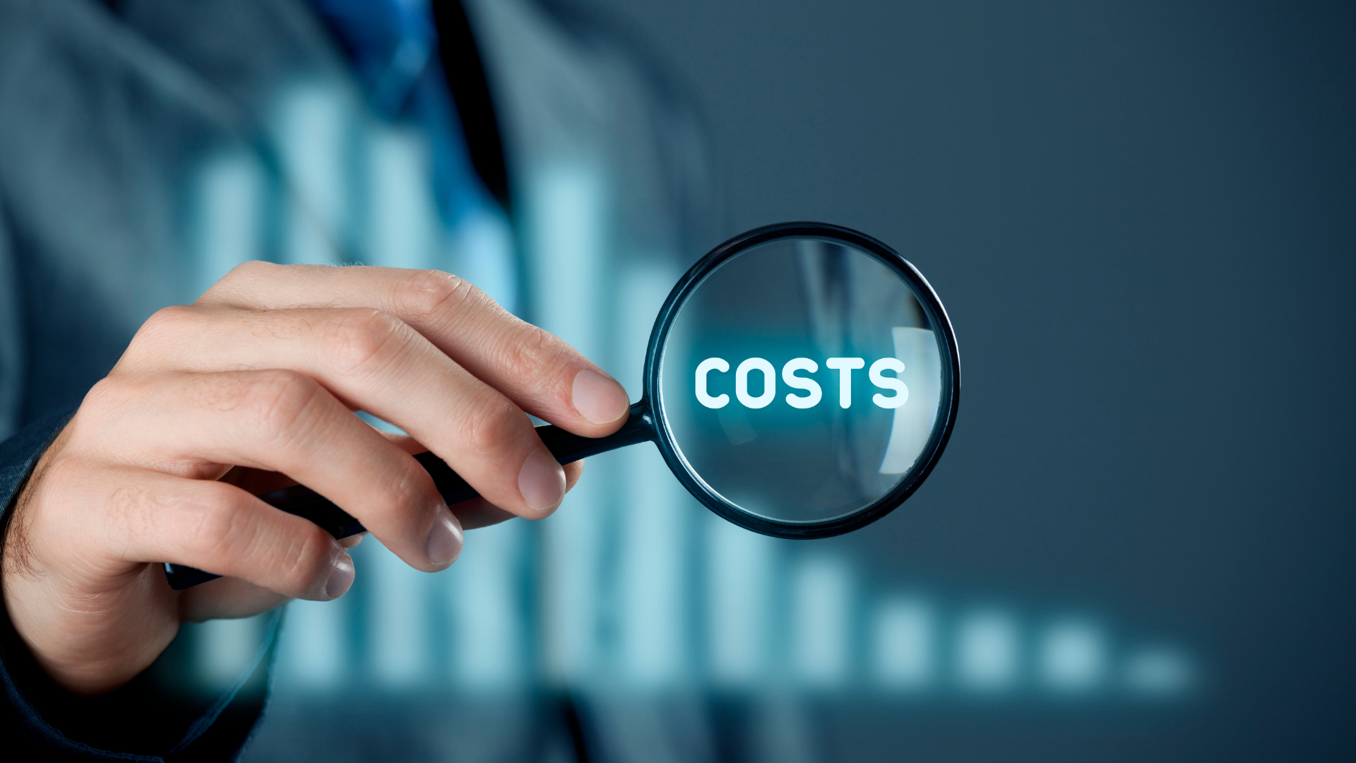 Hand holding a magnifying glass over the word COSTS with a bar chart, representing Virginia probate costs