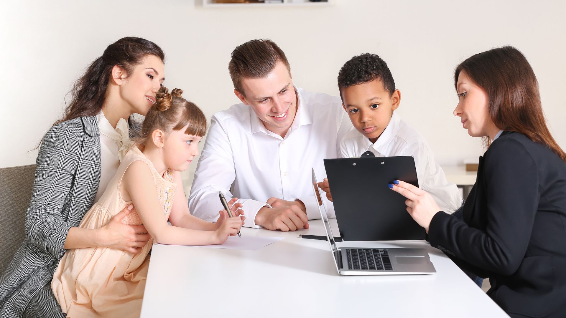 Elderly couple meeting with estate planning attorney at desk overhead view