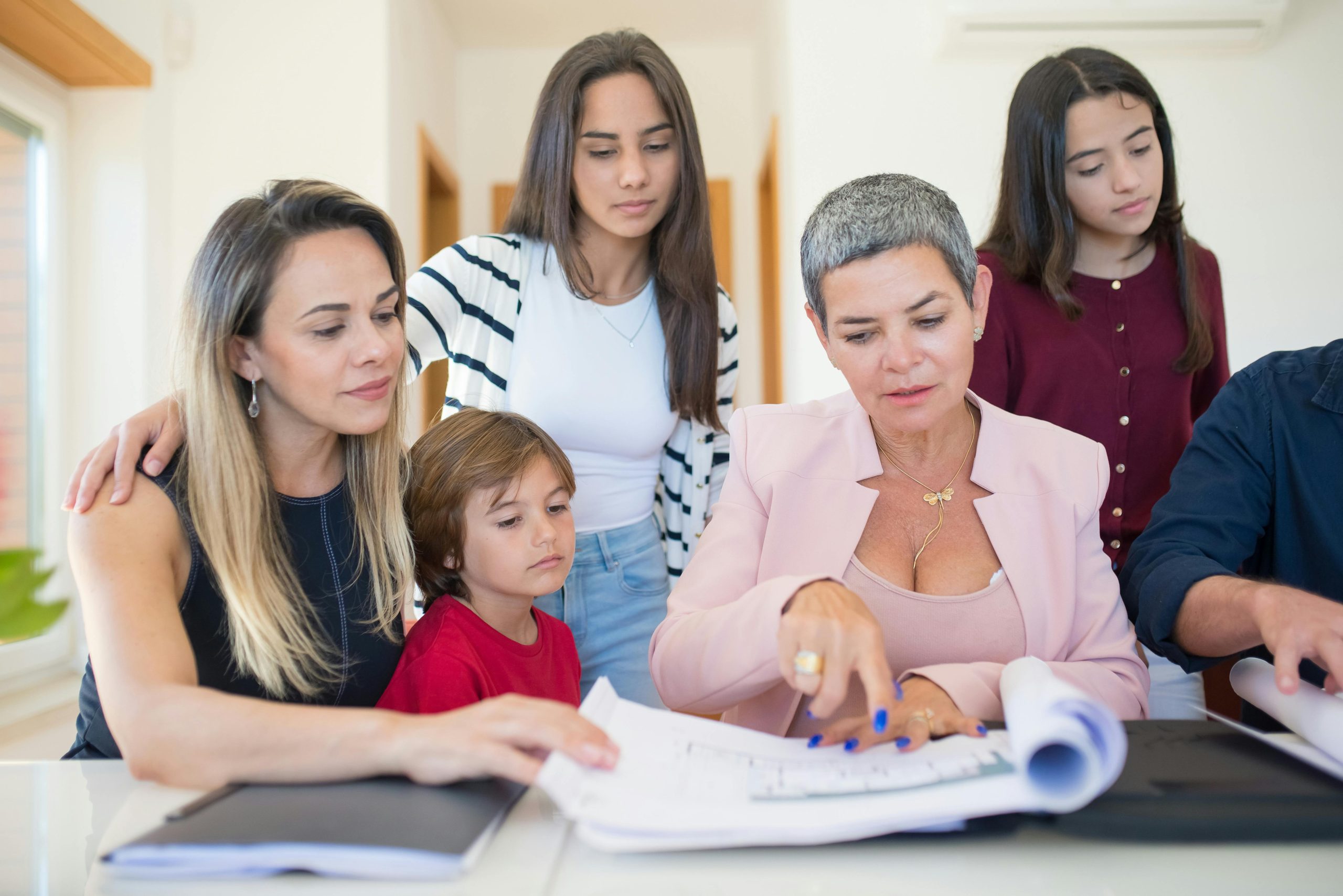 Family reviewing estate planning documents including trust and will options